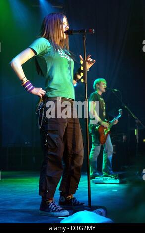 (dpa) - Canadian musician Avril Lavigne performs with her band during her concert in Berlin, 9 March 2003. The concert in Berlin was the first of her concert tour through Germany, where the 18-year-old singer presented her debut album 'Let Go'. Stock Photo