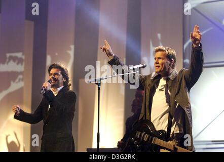 (dpa) - Dieter Bohlen (R) and Thomas Anders of the German pop duo Modern Talking perform during the 'Bravo Supershow 2003' in Cologne, Germany, 8 March 2003. The show will be broadcast on 22 March on RTL. (ATTENTION: Picture allowed for print only with reference to the event!) Stock Photo