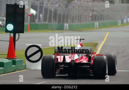 (dpa) - German formula one champion Michael Schumacher gets the green light to start with his Ferrari race car for the first qualifying training on the Albert Park race track in Melbourne, 7 March 2003. Schumacher came in fourth. The Australian Grand Prix will kick off the formula one season on 9 March 2003 in Melbourne. Stock Photo