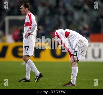 (dpa) - Stuttgart's Belorussian midfielder Alexander Hleb (L) walks and midfielder Jochen Seitz looks down onto the pitch, both are disappointed after the UEFA Champions League soccer game VfB Stuttgart against Celtic Glasgow at the Daimlerstadion in Stuttgart, Germany, 27 February 2003. Stuttgart wins 3-2 but misses the chance to move up to the quarter finals after having lost in  Stock Photo