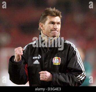 (dpa) - Leverkusen's coach Klaus Augenthaler gestures after his team won the Bundesliga soccer game of VfB Stuttgart against Bayer Leverkusen in Stuttgart, Germany, 17 December 2003. Leverkusen won by a score of 3-2 and ranks third in the German first division. Stock Photo