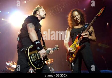 (dpa) - James Hetfield (L) and Kirk Hammet of the US hard rock band Metallica perform during the kick-off concert of their Germany tour in Hanover, Germany, 5 December 2003. With their new album 'St. Anger' they returned to their hard rock roots. Stock Photo