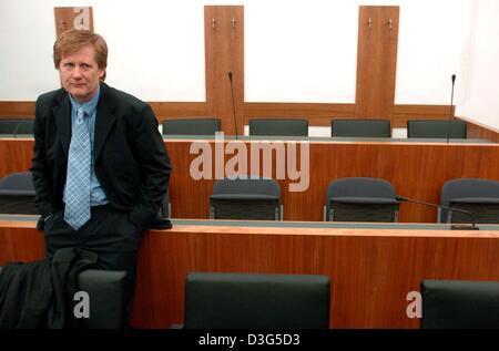 (dpa) - Defence attorney Harald Ermel waits for the beginning of the trial in the regional court in Kassel, Germany, 3 December 2003. The trial of a man who killed and then ate his victim before a running camera began in Kassel in what legal experts say is an unprecedented case for Germany. The defendant, 42-year-old Armin Meiwes, is answering a charge of murder, while his defence  Stock Photo