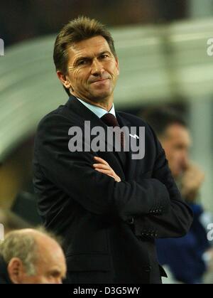 (dpa) - Leverkusen's soccer coach Klaus Augenthaler stands with folded arms on the sideline and smiles as he watches the action on the pitch during the Bundesliga soccer game Bayer 04 Leverkusen against Borussia Dortmund in Dortmund, Germany, 22 November 2003. Leverkusen was behind by two goals during the game but in the end managed two play to a 2-2 (1-2) draw. Stock Photo