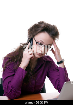 Stressed Businesswoman talking on the phone isolated on white studio shot Stock Photo