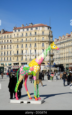 Public Square & Painted Sculpture of Colourful Giraffe in Pedestrian Zone of Quay, Quayside or Quai des Belges Vieux Port Marseille Provence France Stock Photo