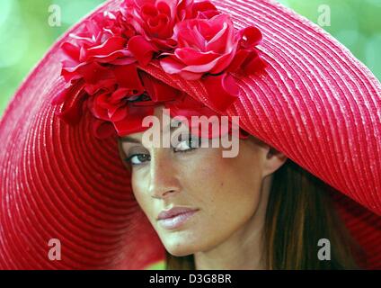(dpa) - The model Panni presents the hat model 'Red Lady' for the spring/summer season 2004 at the CPD fashion show in Duesseldorf, Germany, 4 August 2003. Stock Photo