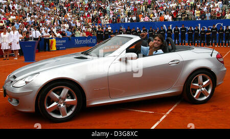 (dpa) - Spanish tennis pro Rafael Nadal sits in his won Mercedes after the final against the Argentinian Gaston Gaudio at the ATP Mercedes Cup in Weissenhof Stuttgart, Germany, Sunday, 24 July 2005. Nadal does not have a driver's licence yet. Nadal defeated Gaudio with 6-3, 6-3, and 6-4. The 27th Stuttgart Wiesenhof tennis tournament, which runs until Sunday 24 July 2005, is endowe Stock Photo