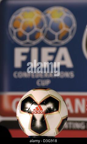 (dpa) - The official soccer ball for the Confederations Cup is presented at the tournament's competition draw ceremony in Frankfurt, Germany, 1 November 2004. The ball, produced by adidas, will be used excusively at the Confederations Cup which will take place in Germany from 15 June until 29 June 2005. In the background the emblem of soccer's world governing body FIFA can be seen. Stock Photo
