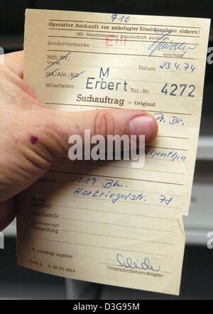 (dpa) - An employee holds a written order regarding the postal surveillance by the former East German secret police Stasi at the archives in Berlin, Germany, 9 November 2004. About 2.5 million files regarding the Stasi's postal surveillance can be found at the archives. Surveillance of mail by the Stasi was stopped 15 years ago on 10 November 1989. Stock Photo