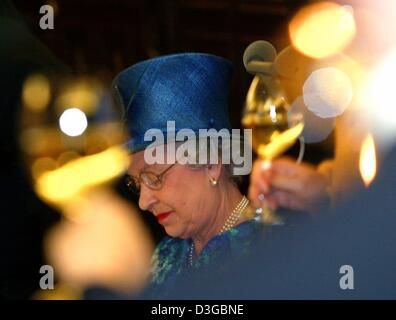 (dpa) - Her Majesty the Queen looks down during a lunch with German state of Brandenburg Prime Minister Matthias Platzeck at Cecilienhof castle in Potsdam, Germany, 3 November 2004. The Queen and her husband Prince Philip Duke of Edinburgh visit the German states of Berlin, Brandenburg and North Rhine Westphalia between 2 and 4 November 2004. It is the fourth state visit to Germany Stock Photo