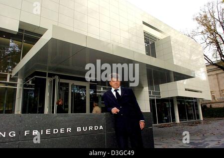 (dpa) - Entrepreneur and arts collector Frieder Burda poses in front of the new museum building which will accomodate the Frieder Burda collection in Baden-Baden, Germany, on Thursday, 21 October 2004. The building was conceived by US architect Richard Meier and the museum was officially opened on Friday, 22 October 2004. Stock Photo