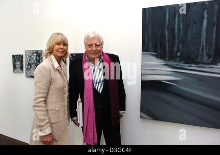 (dpa) - Gunter Sachs, Swiss photographer, arts collector and ex-husband of Brigitte Bardot, with his wife Mirja stands in front of paintings by German artist Gerhard Richter during the opening of the new museum building which accomodates the Frieder Burda collection in Baden-Baden, Germany, 22 October 2004. The building was conceived by US architect Richard Meier and the museum was Stock Photo