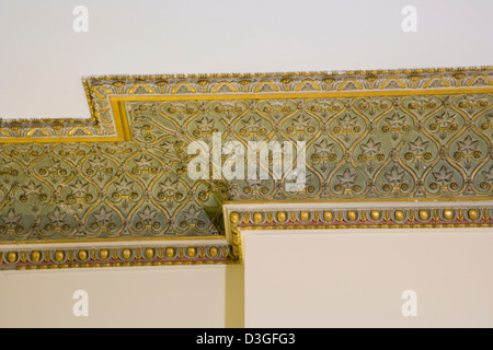 Decorative ceiling coving plaster mouldings in need of some repair. Stock Photo