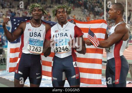 (dpa) - US runner and winner Shawn Crawford (C) jubilates with teammates Bernard Williams (R) who finishes second and Justin Gatlin who takes bronze in the men's 200m sprint final in the Olympic stadium at the Athens 2004 Olympic Games, Thursday 26 August 2004. Stock Photo