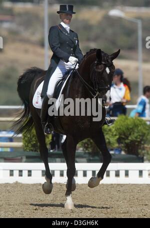 (dpa) - Anky van Grunsven from the Netherlands on her mount Salinero rides the Mixed Individual Dressage Grand Prix Special at the Markopoulo Olympic Equestrian Centre during the Athens 2004 Olympic Games, Monday, 23 August 2004. Stock Photo