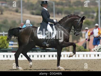 (dpa) - Anky van Grunsven from the Netherlands on her mount Salinero rides the Mixed Individual Dressage Grand Prix Special at the Markopoulo Olympic Equestrian Centre during the Athens 2004 Olympic Games, Monday, 23 August 2004. Stock Photo