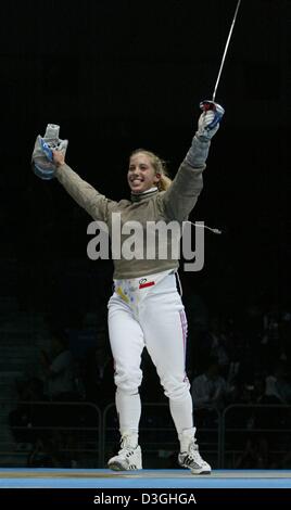 (dpa) - US fencer Mariel Zagunis smiles and cheers after winning the women's individual sabre gold medal bout at the 2004 Olympic Games in  Athens, Greece, 17 August 2004. The individual sabre discipline premiered for the first time at the Olympic Games and Zagunis is the first ever US fencer to win Olympic gold. Stock Photo