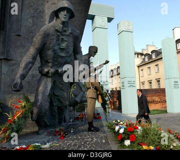 (dpa) - German Chancellor Gerhard Schroeder (R) walks up the steps towards the memorial which commemorates the resistance fighters and people killed in the Warsaw Uprising, in Warsaw, Poland, 01 August 2004. Schroeder was among the international guests who participated in the celebrations commemorating the 60th anniversary of the Warsaw Uprising. Stock Photo