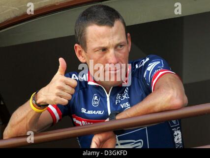 (dpa) - On the Tour de France's last off day, five time Tour winner Lance Armstrong of team US Postal gives a thumbs up from his hotel room in St-Paul-Trois-Chateaux, France, 19 July 2004. Before the decisive stages of the cycling race in the Alpes, Armstrong trails the leader, Frenchman Thomas Voeckler, by only 22 seconds. Stock Photo