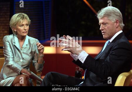 (dpa) - Former US President Bill Clinton (R) gestures as he speaks during a television talk-show hosted by German television presenter Sabine Christiansen in Berlin, 11 July 2004. The 57-year-old ex-President presented his autobiography 'My Life' and spoke about his life after his presidency. ATTENTION: CURRENT NEWS SERVICES OUT Stock Photo
