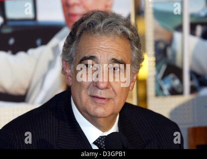 (dpa) - Spanish tenor Placido Domingo poses in front of the advertisement for his only concert in Germany this year, in Cologne, 6 March 2004. Stock Photo