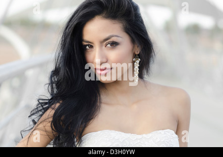 Portrait of a beautiful exotic young woman with long dark hair Stock Photo