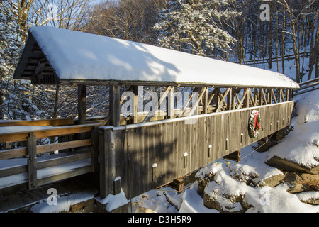 Franconia Notch State Park - Sentinel Pine Covered Bridge during the winter months. Stock Photo