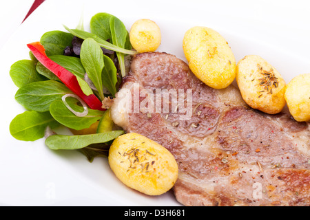 Closeup Of Grilled Steak With New Potatoes Stock Photo