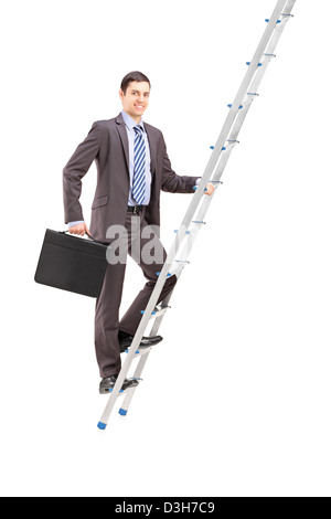 Full length portrait of a businessman climbing a ladder, isolated on white background Stock Photo