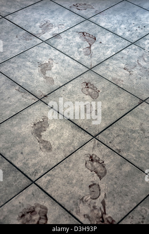 bloody footprints on a bathroom floor Stock Photo