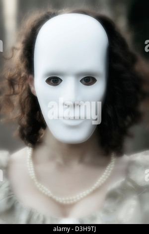 Scary white mask in the dark. Spooky guy in black jacket and white  masquerade. Black, invisible eyes. Halloween style Stock Photo - Alamy