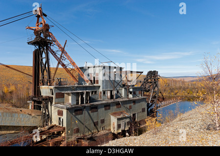 old gold dredge Fairbanks Alaska river creek gold mining Stock Photo