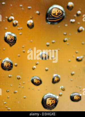Feb. 19, 2013 - San Francisco, CA, USA - A UPS truck is seen refracted in raindrops during a delivery on February 19, 2013 in San Francisco, California. (Credit Image: © Josh Edelson/ZUMAPRESS.com) Stock Photo