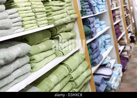 Towels on shelves in the shop Stock Photo