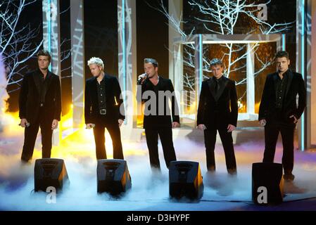 (dpa) - The Irish pop group Westlife performs during the German live television show 'Wetten dass...?' (bet that...?) in Bremen, Germany, 24 January 2004. Stock Photo