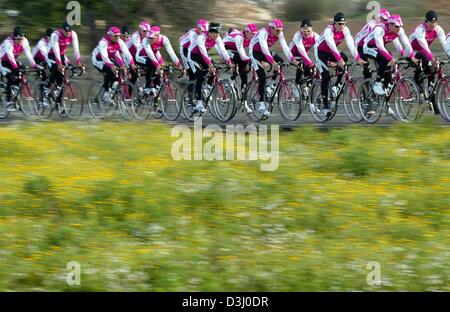 (dpa) - The cycling pros of Team T-Mobile ride with their bicycles through a picturesque countryside during a practice tour on the Balearic Island of Majorca, near Palma de Mallorca, Spain, 13 January 2004. The team attends a training camp for the next two weeks. Jan Ullrich, who suffered from flu, is expected to join the team on 14 January 2004. Stock Photo
