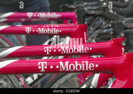 (dpa) - A row of bicycles with the logo of Team T-Mobile stand available for the cycling pros of Team T-Mobile for a practice tour in Cala Serena on the Balearic Island of Majorca near Palma de Mallorca, Spain, 13 January 2004. The team attends a training camp for the next two weeks. Jan Ullrich, who suffered from flu, is expected to join the team on 14 January 2004. Stock Photo