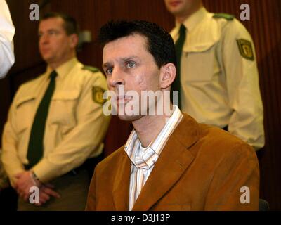 (dpa) - The accused Rolf F., test driver at DaimlerChrysler, awaits his verdict in the courtroom of the district court in Karlsruhe, Germany, 18 February 2004. In a case which stirred public emotions in Germany, a Karlsruhe court Wednesday found the test driver guilty in the deaths of a young woman and her daughter in a high-speed highway accident in July 2003. The court sentenced  Stock Photo