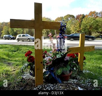 (dpa files) - Two wooden crosses on the A5 motorway remind of the fatal car accident in which a 21-year-old mother and her 2-year-old daughter were killed in July 2003 near Karlsruhe, Germany, 17 October 2003. In a case which stirred public emotions in Germany, a Karlsruhe court on 18 February 2004 found the DaimlerChrysler test driver Rolf F. guilty in the deaths of a young woman  Stock Photo