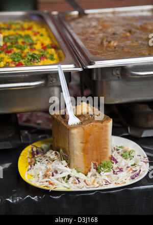 Traditional 'Bunny Chow' dish of Hollowed out Bread Loaf with Meat Filling - Hout Bay Market, Cape Town - South Africa Stock Photo