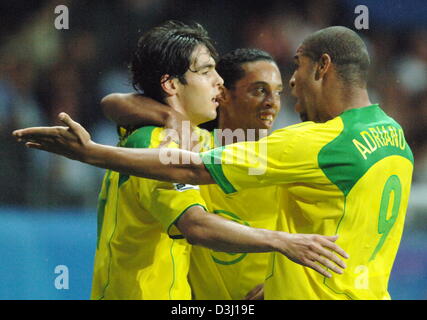 (dpa) - Brazilian player Kaka (L) and his teammates Ronaldinho (C) and Adriano are pleased after scoring the 2-0 lead during the finals of the Confederations Cup tournament in the match Brazil vs Argentina in Frankfurt, Germany, 29 June 2005. (Eds: Internet use and mobile applications subject to FIFA·s terms and conditions) Stock Photo