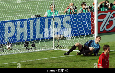 (dpa) - The picture shows dejected German goalkeeper Jens Lehmann (L) and defender Arne Friedrich after the Brazilian team scored the 1-0 lead during the semi-final of FIFA Confederations Cup tournament Germany vs. Brazil in Nuremberg, Germany, 25 June 2005. Stock Photo
