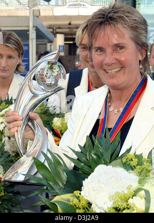 (dpa) - Head Coach of the German Women National soccer team Tina Theune-Meyer smiles after being congratulated for winning the European Championships at Frankfurt Main airport, Germany, Monday 20 June 2005. The German team won the Championship by beating Norway in the final match 3-1. Stock Photo