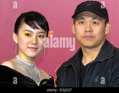 (dpa) - South Korean actress Kwak Ji-Min (L) and South Korean director Kim Ki-Duk smile as they attend a press conference  during the 54th Berlinale International Film Festival in Berlin, 10 February 2004. Kwak Ji-Min and Kim Ki-Duk presented their new film 'Samaria'. Stock Photo