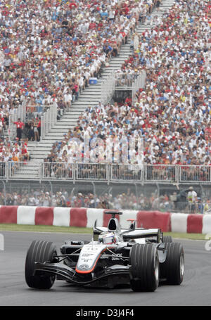 (dpa) - The picture shows Colombian Formula One driver Juan Pablo Montoya of McLaren after the start of the F1 Grand Prix of Canada at the Canadian race track Gilles Villeneuve in Montreal, Canada, 12 June 2005. Stock Photo