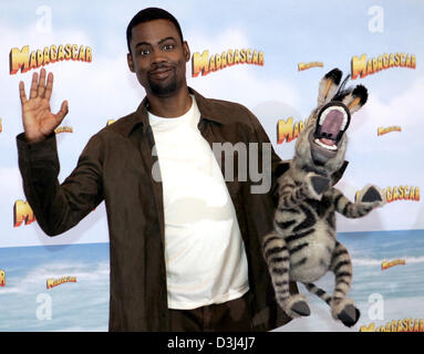 (dpa) - US-Actor Chris Rock fools about with his characters' rag dolls  he voices in the animated film 'Madagascar' at the Hotel Adlon in Berlin, Germany, Friday 10 June 2005. In the animated film the inhabitants of the New York zoo prepare to break free into the big wide world. The German premiere will be on 7 July 2005. Stock Photo