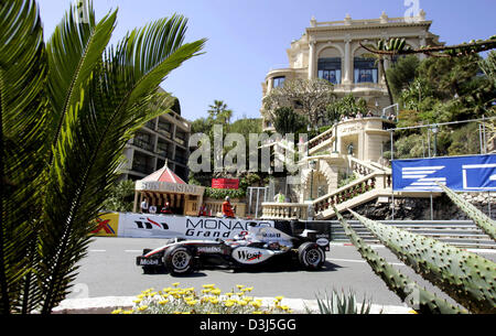 (dpa) - Colombian Formula One driver Juan Pablo Montoya of McLaren Mercedes in action in front of Sun Casino and Grand Hotel during the first practice session for the Monaco Grand Prix in Monte Carlo, Monaco, 19 May 2005. Stock Photo