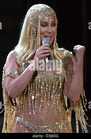 (dpa) - US singer Cher performs on stage at the KoelnArena in Cologne, Germany, 28 May 2004. The concert was the first German show of her worldwide 'Farewell' tour. Cher intends the tour to be her final stage tour. The 58-year-old singer presents her fans a colourful pop spectacle by showing the stages of her 40 year career. Stock Photo