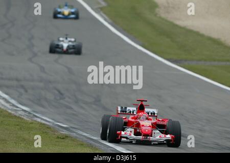 (dpa) - German Formula 1 champion Michael Schumacher (team Ferrari) is in the lead after the first round of the European Grand Prix at the Nuerburgring in Germany, 30 May 2004. Schumacher went on to win the race. Stock Photo